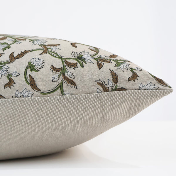 Side view of Hackner Home Sweet Autumn Clematis Block Print pillow cover showing the beige base fabric and detailed floral vine pattern in green, brown, and white.