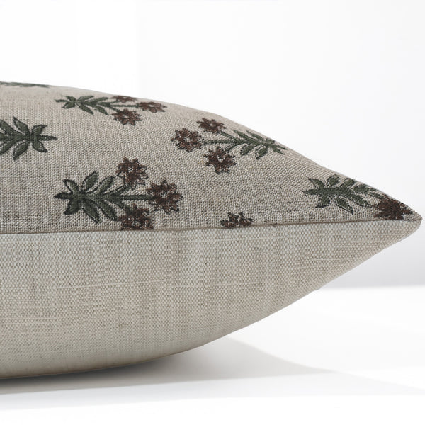 Close-up side view of Hackner Home Wood Lily block print pillow cover showcasing hand-printed floral design in green and brown on natural linen fabric.